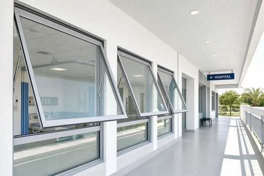 Aluminum awning windows installed on hospital isolation room facade