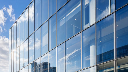 Modern commercial building facade with slim aluminum-framed vacuum insulated glazing panels